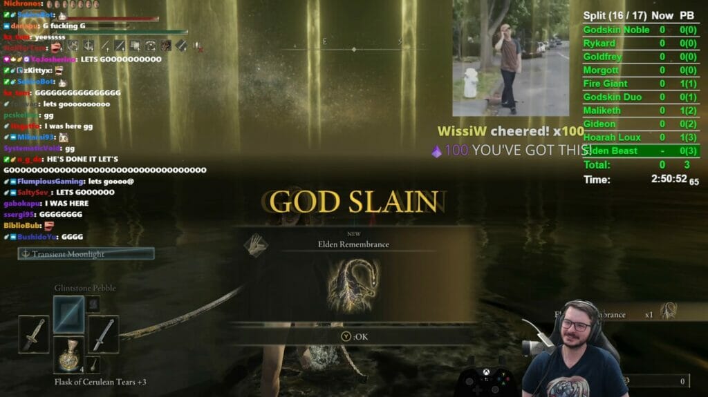 Tela mostra o streamer Seki com overlay mostrando partes do jogo Elden Ring e escrito na tela "God Slain"